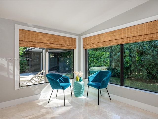 sunroom featuring lofted ceiling