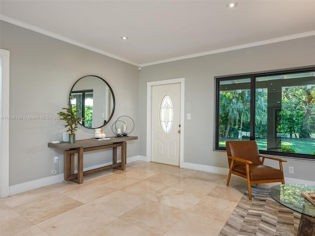 entrance foyer featuring plenty of natural light and ornamental molding