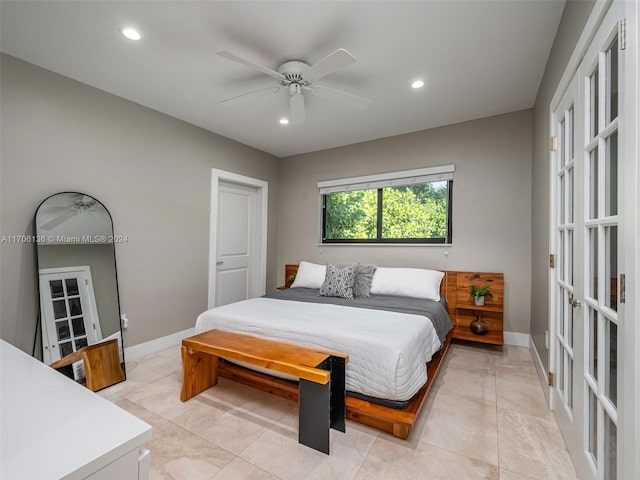 tiled bedroom featuring ceiling fan