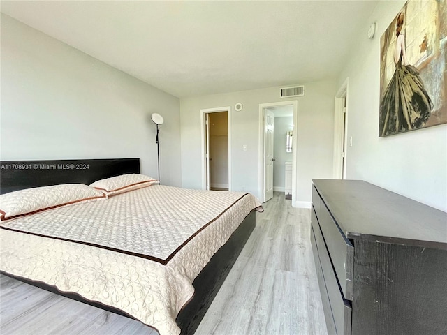 bedroom with light hardwood / wood-style floors