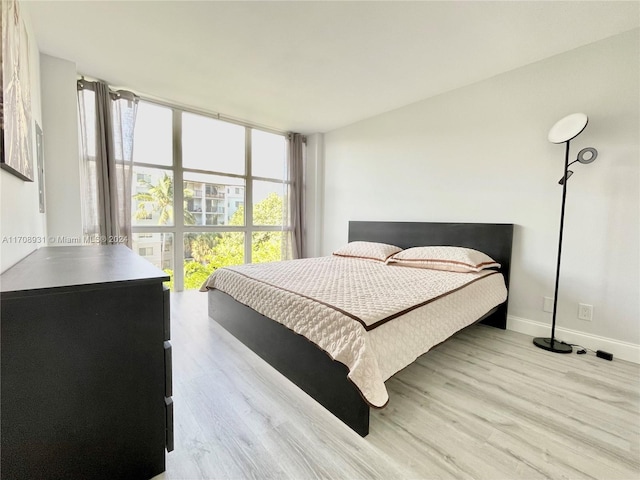 bedroom with light hardwood / wood-style floors