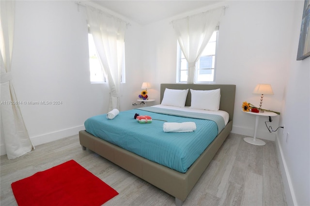 bedroom featuring light wood-type flooring