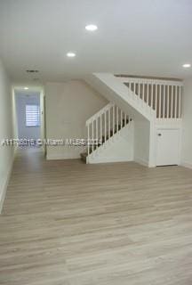 interior space with hardwood / wood-style flooring