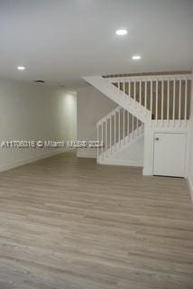 unfurnished room with light hardwood / wood-style flooring