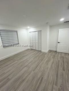 empty room featuring hardwood / wood-style flooring