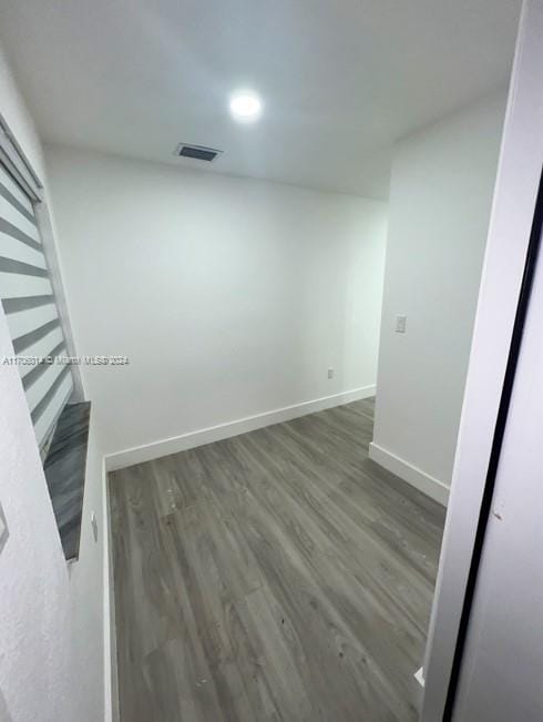 spare room featuring dark hardwood / wood-style flooring