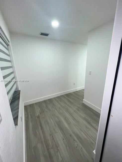 spare room featuring dark hardwood / wood-style floors