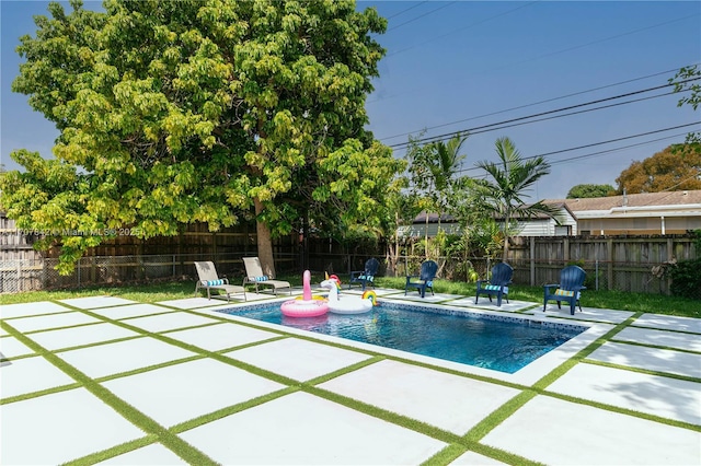 view of swimming pool with a patio