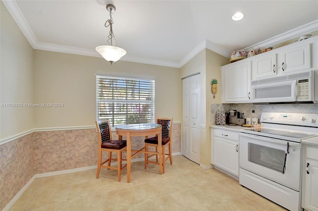 kitchen featuring white cabinets, decorative light fixtures, white appliances, and crown molding