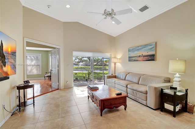 tiled living room featuring high vaulted ceiling, ceiling fan, and ornamental molding