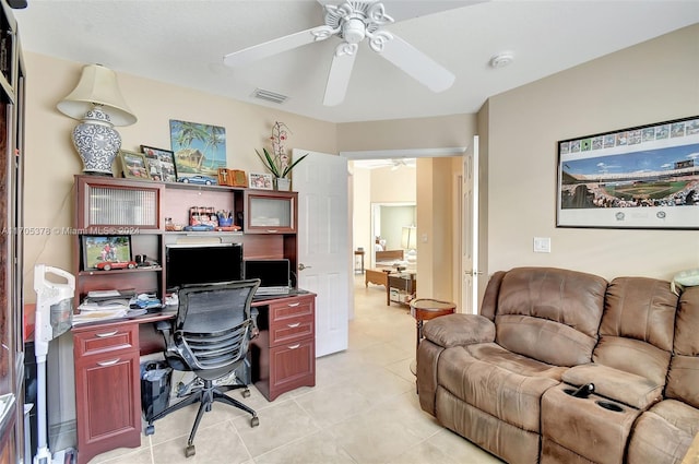 tiled office space with ceiling fan