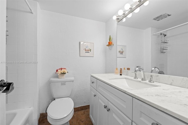 full bathroom with tile patterned flooring, vanity, toilet, and tiled shower / bath combo