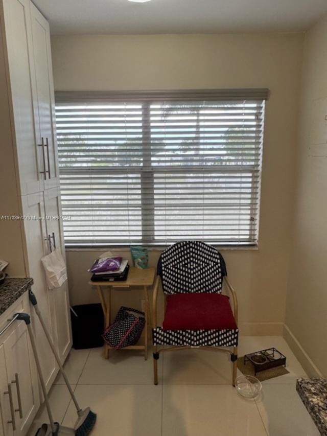 sitting room featuring tile patterned flooring