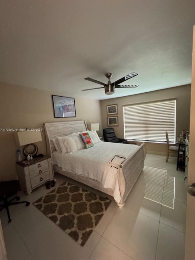 bedroom featuring ceiling fan and light tile patterned flooring