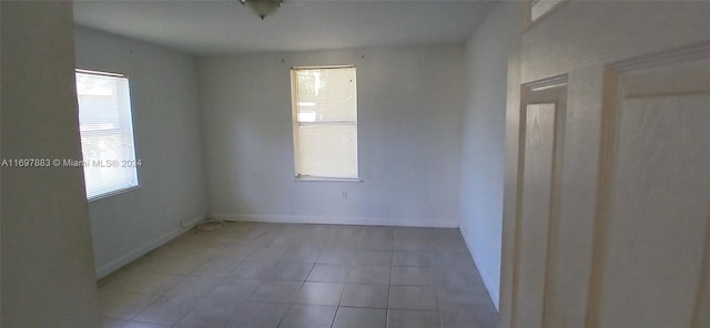 spare room with light tile patterned floors