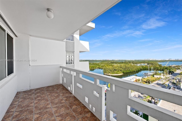 balcony featuring a water view