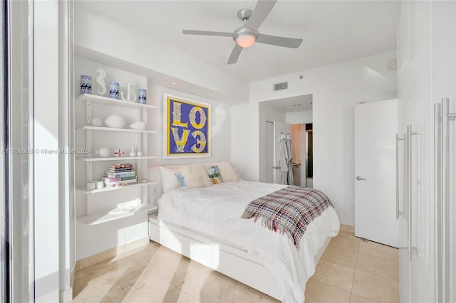 bedroom with ceiling fan and a closet