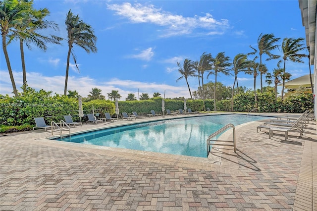 view of swimming pool with a patio area