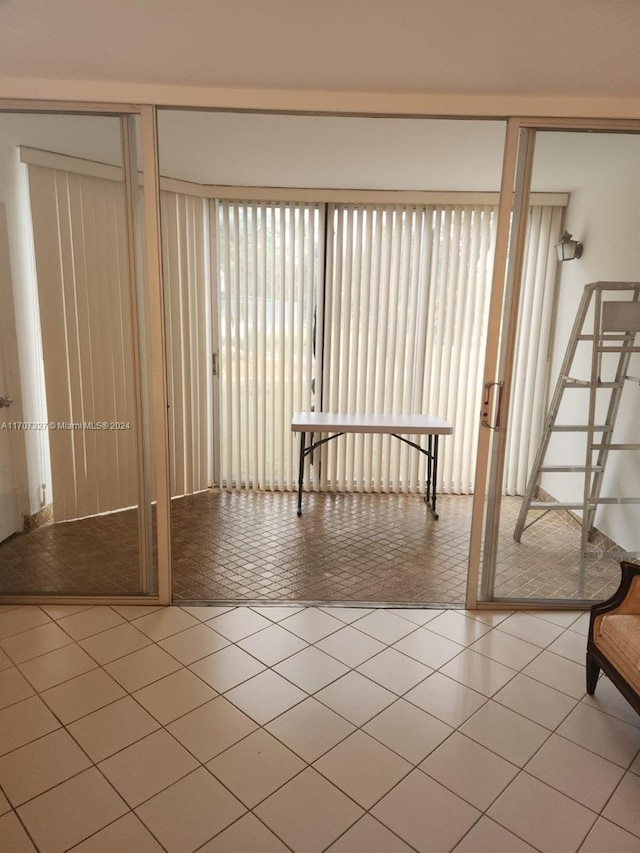 interior space featuring tile patterned flooring and a wealth of natural light