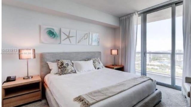 bedroom featuring carpet flooring, access to exterior, and floor to ceiling windows