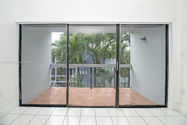 entryway featuring light tile patterned floors and a healthy amount of sunlight