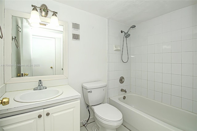 full bathroom with vanity, toilet, and tiled shower / bath combo