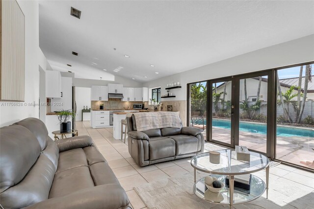 unfurnished dining area with light tile patterned floors and a textured ceiling