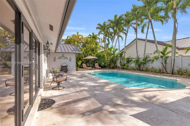 view of pool featuring a patio