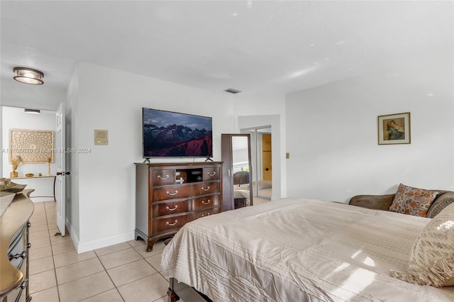 living area with wood walls, light tile patterned floors, and a textured ceiling