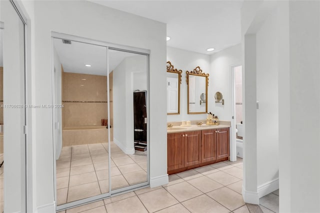 bathroom featuring toilet, vanity, and tile patterned floors