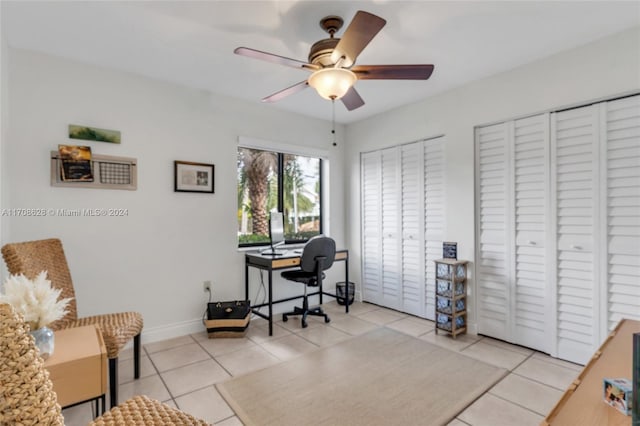 home office featuring ceiling fan and light tile patterned flooring