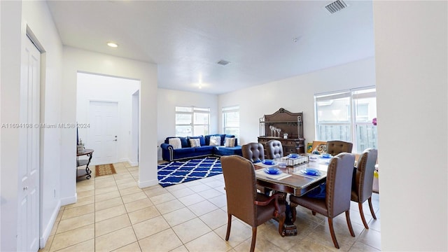 dining space with light tile patterned floors