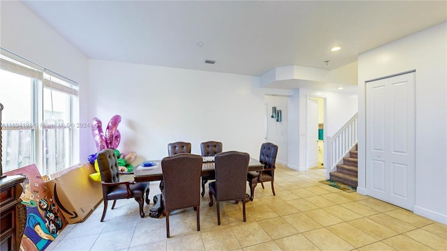 dining area with light tile patterned floors