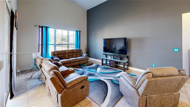 tiled living room with high vaulted ceiling