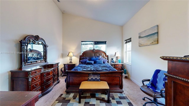 bedroom featuring light carpet and vaulted ceiling