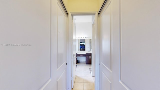 corridor with light tile patterned floors