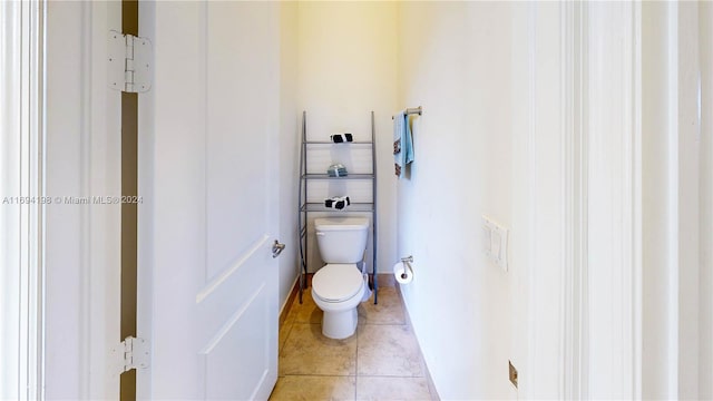 bathroom with tile patterned floors and toilet