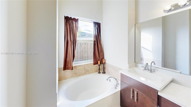 bathroom featuring vanity and a washtub