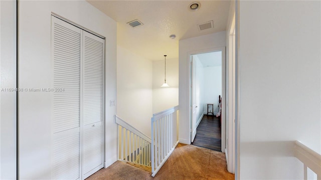 corridor with carpet floors