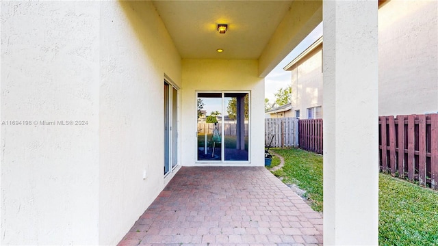 entrance to property featuring a patio area