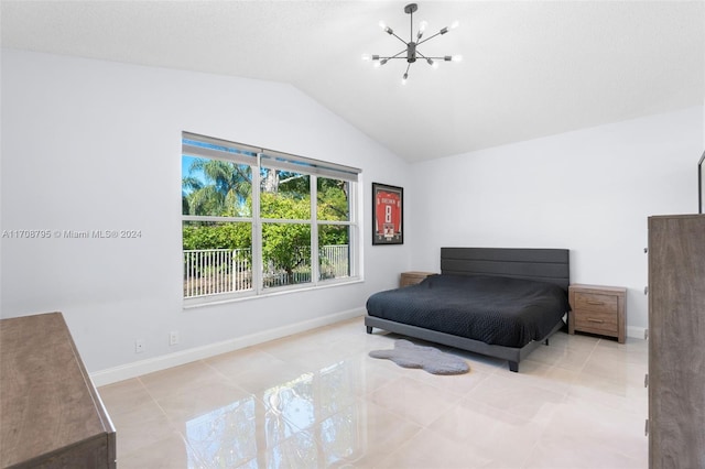 tiled bedroom with an inviting chandelier and vaulted ceiling