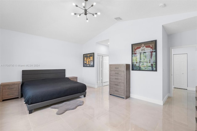 bedroom with a chandelier, a closet, and lofted ceiling