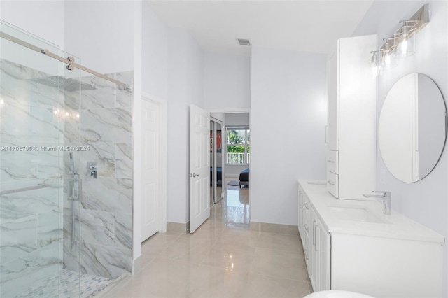 bathroom featuring vanity and an enclosed shower