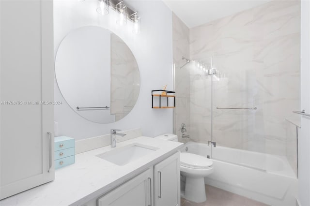 full bathroom featuring vanity, toilet, and bath / shower combo with glass door