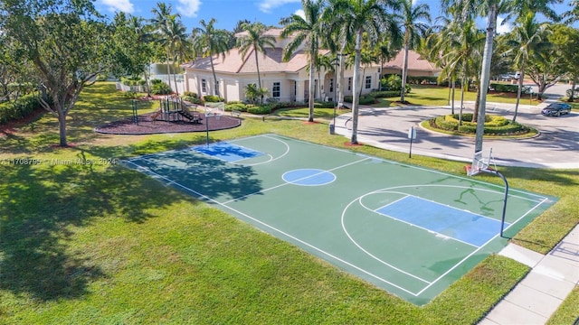 view of basketball court featuring a playground and a yard