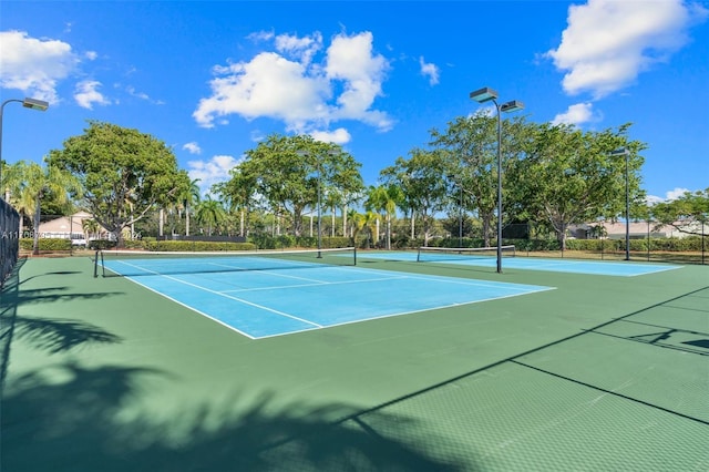 view of sport court featuring basketball hoop