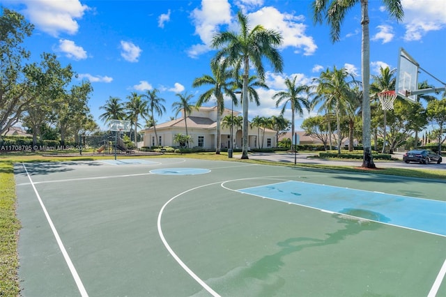 view of sport court featuring a playground