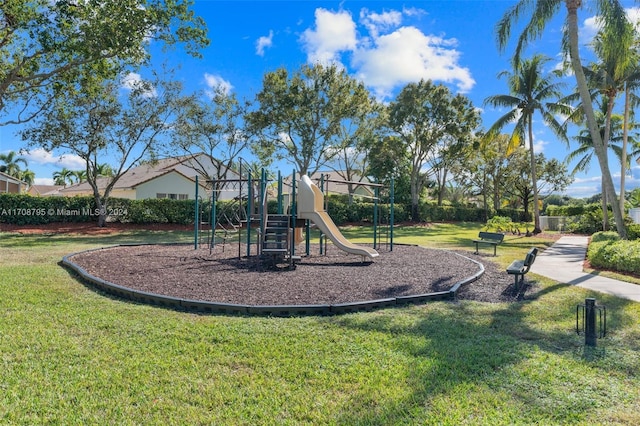 view of jungle gym featuring a lawn