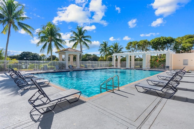 view of swimming pool with a pergola and a patio area