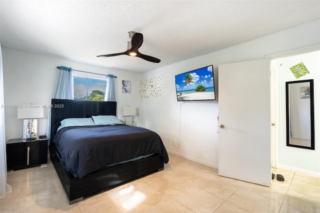 tiled bedroom featuring multiple windows, a textured ceiling, and ceiling fan